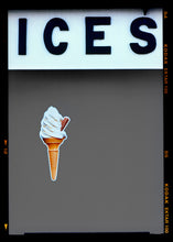 Load image into Gallery viewer, Photograph by Richard Heeps.  At the top black letters spell out ICES and below is depicted a 99 icecream cone sitting left of centre against a grey coloured background.  