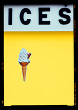 Load image into Gallery viewer, Photograph by Richard Heeps.  At the top black letters spell out ICES and below is depicted a 99 icecream cone sitting left of centre against a sherbert yellow coloured background.  
