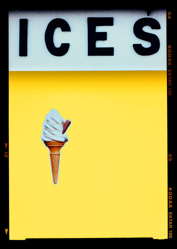 Photograph by Richard Heeps.  At the top black letters spell out ICES and below is depicted a 99 icecream cone sitting left of centre against a sherbert yellow coloured background.  