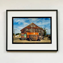 Load image into Gallery viewer, Model T and Garage Kodak Film photograph framed in black.