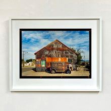Load image into Gallery viewer, Model T and Garage Kodak Film photograph framed in white.
