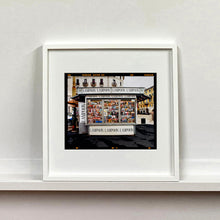 Load image into Gallery viewer, News Stand Milan, Italian street photography by Richard Heeps mounted square framed in white.