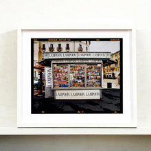 Load image into Gallery viewer, News Stand Milan, Italian street photography by Richard Heeps small print framed in white.