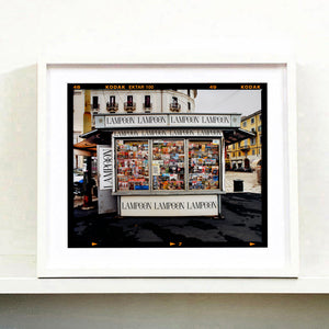 News Stand Milan, Italian street photography by Richard Heeps small print framed in white.