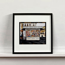 Load image into Gallery viewer, News Stand Milan, Italian street photography by Richard Heeps mounted square framed in black.