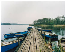 Load image into Gallery viewer, Ormesby Little Broad, a docking jetty with small boats stretches out to the Norfolk Broad photograph by Richard Heeps.