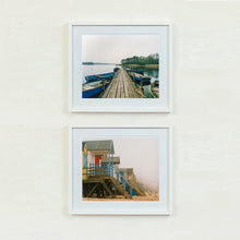 Load image into Gallery viewer, Ormesby Little Broad and Beach Huts, foggy day Norfolk photographs by Richard Heeps framed in white.