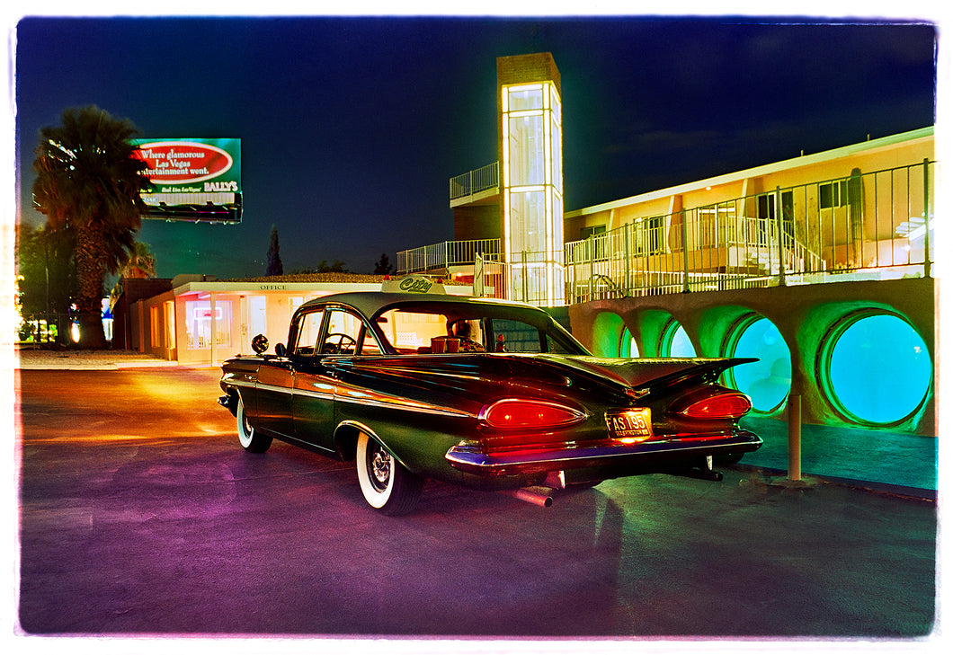 Photograph by Richard Heeps. A Chevy Bel Air is central shot and off to the right are the pools and balcony of the Glass Pool Motel, Las Vegas.