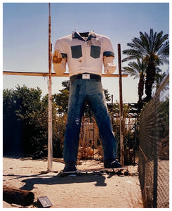 Photograph by Richard Heeps. The headless torso of a giant fibreglass sculpture of a cowboy (a Muffler Man).