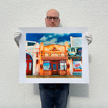 Load image into Gallery viewer, Richard Heeps holding La Belle Femme in the Sun print
