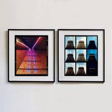 Load image into Gallery viewer, Two black framed photograph by Richard Heeps. On the left hand side a photograph of windows on the interior of San Giovanni Bono Church, a concrete brutalist building in Milan by Italian architect Arrigo Arrighetti. on the right hand side a series of 9 images within a photograph which chart the lighting on the Torre Velasca, Milan during the day and night.