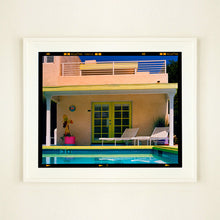 Load image into Gallery viewer, White framed photograph by Richard Heeps. Palm Springs Pool Side II showcases classic mid-century Palm Springs California architecture. Cool blue skies and pool with accents of pink and almost neon yellow. 