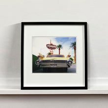 Load image into Gallery viewer, Black framed photograph by Richard Heeps.  The back end of the classic American car with a number place DREAM01 sits underneath the STARDUST casino sign.