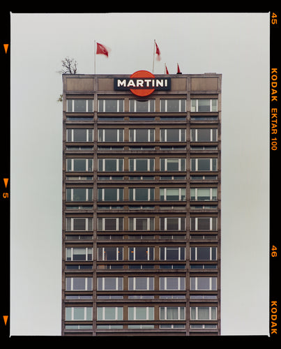 Photograph by Richard Heeps. High rise offices with Martini logo on the top facade. 
