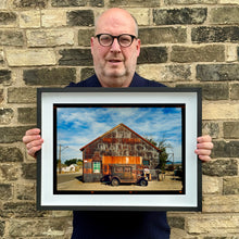 Load image into Gallery viewer, Richard Heeps holding Model T and Garage framed in black