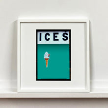 Load image into Gallery viewer, White framed photograph by Richard Heeps.  At the top black letters spell out ICES and below is depicted a 99 icecream cone sitting left of centre against a Turquoise Teal coloured background.  