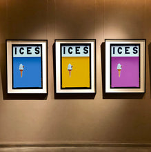 Load image into Gallery viewer, Set of three photographs by Richard Heeps.  Three identical photographs (apart from the block colour), at the top black letters spell out ICES and below is depicted a 99 icecream cone sitting left of centre set against, in turn, a baby blue, mustard and plum coloured background.  