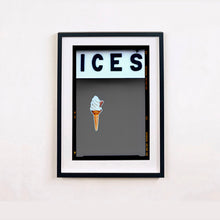 Load image into Gallery viewer, Black framed photograph by Richard Heeps.  At the top black letters spell out ICES and below is depicted a 99 icecream cone sitting left of centre against a grey coloured background.  