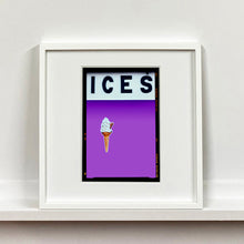 Load image into Gallery viewer, White framed photograph by Richard Heeps.  At the top black letters spell out ICES and below is depicted a 99 icecream cone sitting left of centre against a lilac coloured background.  
