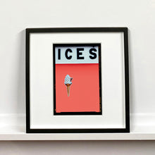 Load image into Gallery viewer, Black framed photograph by Richard Heeps.  At the top black letters spell out ICES and below is depicted a 99 icecream cone sitting left of centre against a melondrama red orange coloured background.  