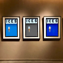 Load image into Gallery viewer, Set of three photographs by Richard Heeps.  Three identical photographs (apart from the block colour), at the top black letters spell out ICES and below is depicted a 99 icecream cone sitting left of centre set against, in turn, a sky blue, grey and blue coloured background.  