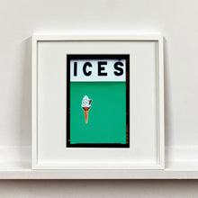 Load image into Gallery viewer, White framed photograph by Richard Heeps.  At the top black letters spell out ICES and below is depicted a 99 icecream cone sitting left of centre against a viridian green coloured background.  