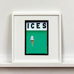 White framed photograph by Richard Heeps.  At the top black letters spell out ICES and below is depicted a 99 icecream cone sitting left of centre against a viridian green coloured background.  