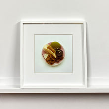 Load image into Gallery viewer, White framed photograph by Richard Heeps. A vintage pink soap dish sits on a white surface. Looking down onto the soap dish which contains two plugs, green soap, nail brush, cork and a sponge/wire wool combo.