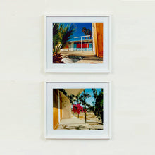 Load image into Gallery viewer, Two white framed photographs by Richard Heeps. The top photograph is of a colourful but derelict vintage motel sitting in the blue Californian sun. Palm trees appear behind and to the side. The bottom photograph has the motel room doors on the left hand side over top is the porch and in the centre of the photo hangs a beautiful pink bougainvillea.