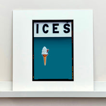 Load image into Gallery viewer, Mounted photograph by Richard Heeps.  At the top black letters spell out ICES and below is depicted a 99 icecream cone sitting left of centre against a blue teal coloured background.  