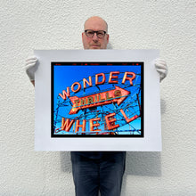 Load image into Gallery viewer, Richard Heeps holding Thrills Coney Island print