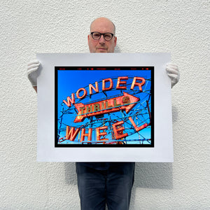 Richard Heeps holding Thrills Coney Island print