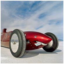 Load image into Gallery viewer, Photograph by Richard Heeps.  The side on front of a red belly tank racing car, it is designed as a shark eating a $100 bill.