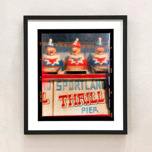 Thrill Pier clowns amusements photograph by Richard Heeps framed in black