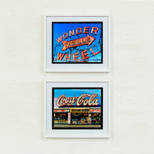 Load image into Gallery viewer, Two framed vintage-style signs on a white wall, one with &#39;Wonder Wheel&#39; and the other with &#39;Coca-Cola&#39; artworks by Richard Heeps
