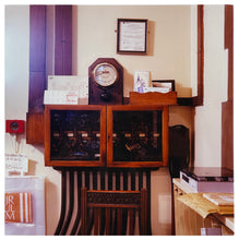 Load image into Gallery viewer, Vintage photograph by Richard Heeps. Antique telephone exchange with meter on top in working library