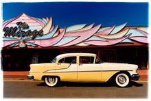 Load image into Gallery viewer, Photograph by Richard Heeps. A yellow classic American car sits on the road outside the Mirage amusement arcade in Hemsby, Norfolk.