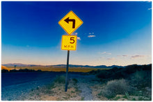 Load image into Gallery viewer, Part of Richard Heeps&#39; &#39;Dream in Colour&#39; Series, this beautiful picture taken at dusk captures the sunset in the valley.  It was photographed in what was once a goldmine, now a ghost town. The 5MPH sign seems so cautious, but on closer inspection you see that it is peppered with bullet holes, serving as a reminder of its Western past. 