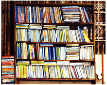 Load image into Gallery viewer, Multi-color books in a book case.