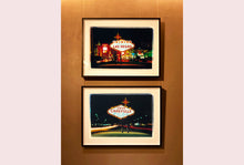 Load image into Gallery viewer, Taken upon leaving Las Vegas, and featured in Richard Heeps&#39; &#39;Dream in Colour&#39; series, this piece features a classic American neon sign, with the Las Vegas lights disappearing into the distance. 