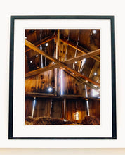 Load image into Gallery viewer, Light breaks through the cracks in the barn on the movie set of Clint Eastwood&#39;s Western film &#39;The Outlaw Josey Wales&#39;. Captured in Kanab, Utah, which was the setting of many Western movies. Photographed by Richard Heeps for his &#39;Dream in Colour&#39; series.