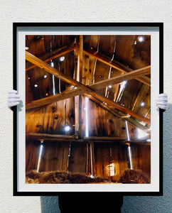 Light breaks through the cracks in the barn on the movie set of Clint Eastwood's Western film 'The Outlaw Josey Wales'. Captured in Kanab, Utah, which was the setting of many Western movies. Photographed by Richard Heeps for his 'Dream in Colour' series.