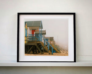 'Beach Huts', photographed by Richard Heeps in one of his favourite areas of the UK, the port town of Wells-next-the-sea, Norfolk. This piece captures the classic quintessential beach hut on an atmospherically foggy day.