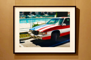 An American car parked up by the swimming pool outside the Algiers Hotel in Las Vegas. Photography by Richard Heeps, part of his 'Dream in Colour' series.