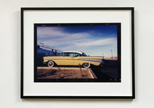 Load image into Gallery viewer, &#39;Chevy at the Diner&#39; was photographed in Bisbee, Arizona in 2001 but printed by Richard in his darkroom for the first time more recently in 2018. This cinematic artwork that features a vintage yellow chevy parked up at a Diner will take you on an American road trip. 