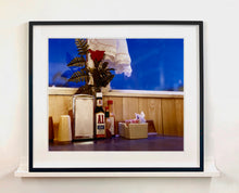 Load image into Gallery viewer, &#39;Condiments&#39; shows a classic American Diner table-scape, captured at the Bonanza Café in the small town of Lone Pine, California. This piece is part of Richard Heeps&#39; &#39;Dream in Colour&#39; series.