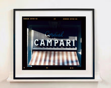 Load image into Gallery viewer, Cordial Campari, photographed as part of Richard Heeps’ series &#39;A Short History of Milan’ features beautiful and bold typography above the striped awning of a fascist building. 