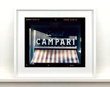 Load image into Gallery viewer, Cordial Campari, photographed as part of Richard Heeps’ series &#39;A Short History of Milan’ features beautiful and bold typography above the striped awning of a fascist building. 