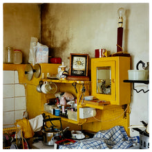 Load image into Gallery viewer, Photograph by Richard Heeps.  Yellow ramshackled vintage kitchen.