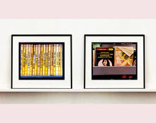 Load image into Gallery viewer, As part of Richard Heeps&#39; series, A Short History of Milan, Delitto A Hollywood features a series of yellow Italian books from a street kiosk. 